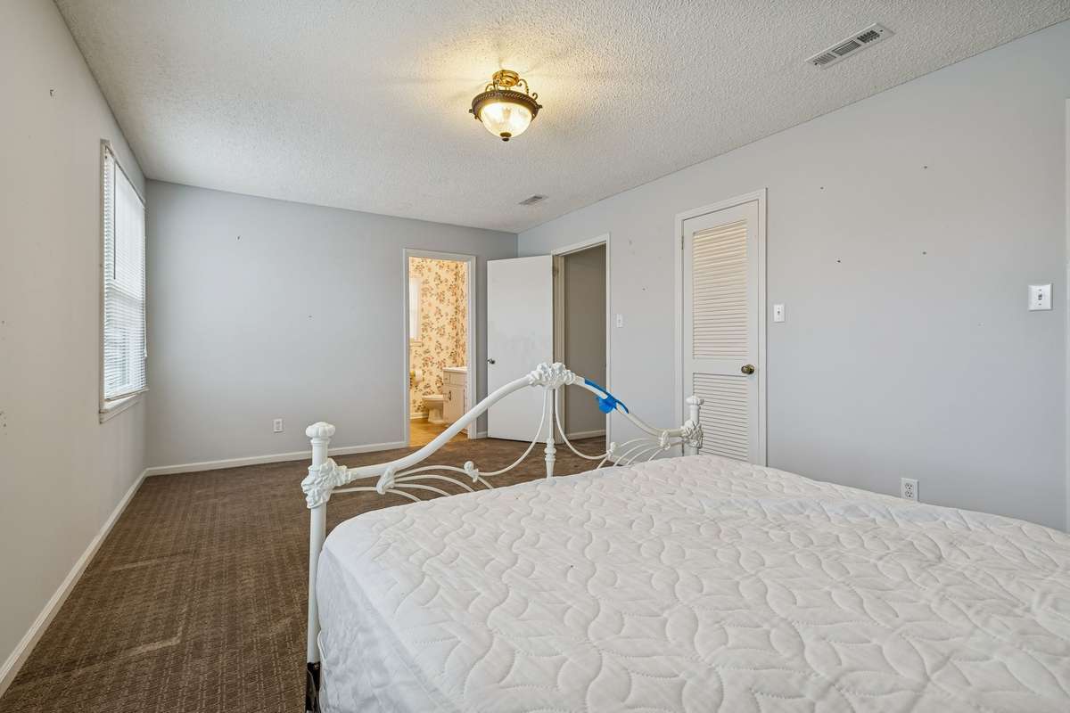 Upstairs primary bedroom with full bathroom.