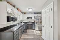 Kitchen with new black granite counter tops