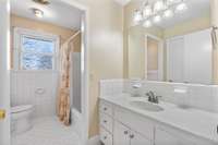 Hall bath with linen closet.