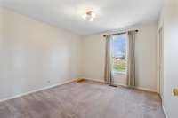 Secondary bedroom.  Zoom in to view hardwood floors.