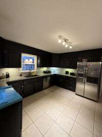 AND THE KITCHEN IS SO VERY SPACIOUS TOO - GRANITE COUNTERS!!  LOTS OF CABINETS!!
