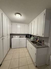 SPACIOUS LAUNDRY ROOM, TOO!!  WITH CABINETS!!