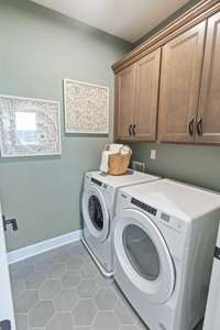 Laundry room upstairs near bedrooms.