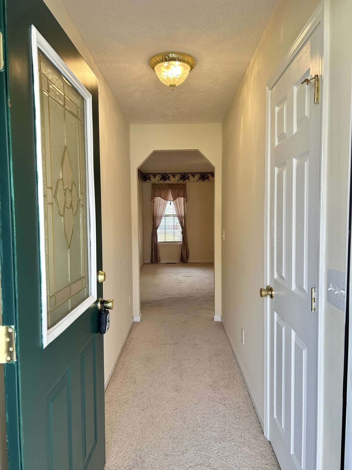 The foyer as you enter the home from the front door. Notice the coat closet for convenience and extra storage!!