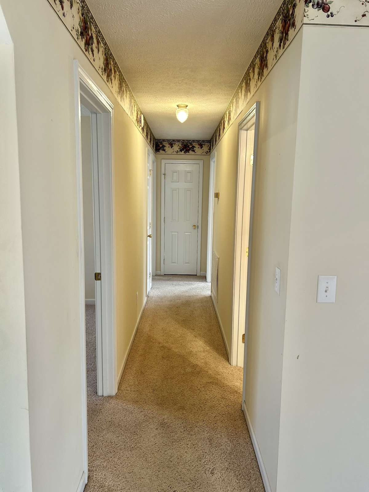 Down the hall leads to the 3 bedrooms and two bathrooms!!