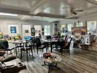 Florida room in the primary residence. Bright and airy with plenty of natural light.