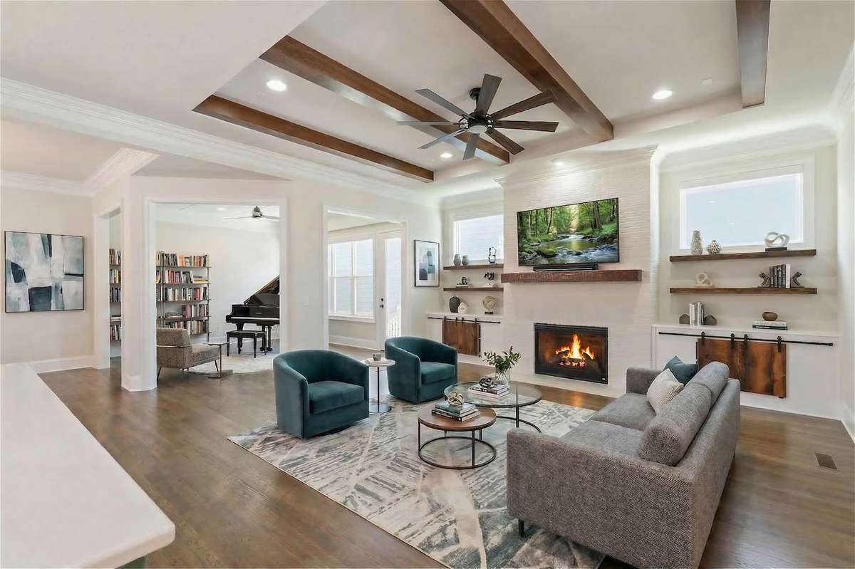 Living Room with a sitting room/ piano room/ library. SO many options for more living space on the main floor.
