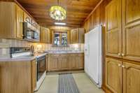 PINTEREST WORTHY KITCHEN!!! 
WOOD Ceiling + Custom Cabinetry
Appliance Package including (Side-by-side Refrigerator, Stove, Microwave)