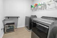 Upstairs Laundry Room conveniently located adjacent to primary suite - Washer & Dryer included
