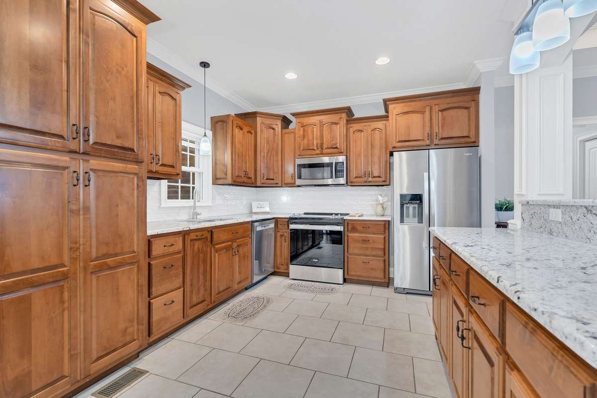The Kitchen features custom stacked cabinetry.