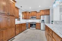 The Kitchen features custom stacked cabinetry.