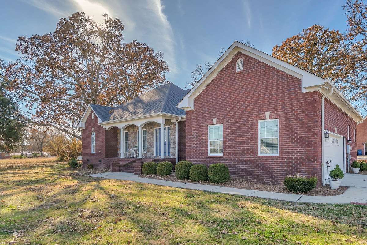 This home is located on a corner lot with beautiful landscaping and mature trees.