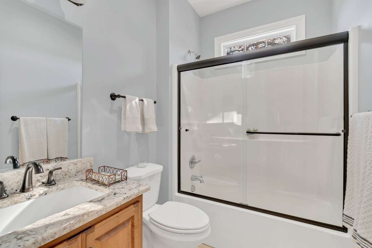 A full bath with tub/shower combination is located between the secondary bedrooms.