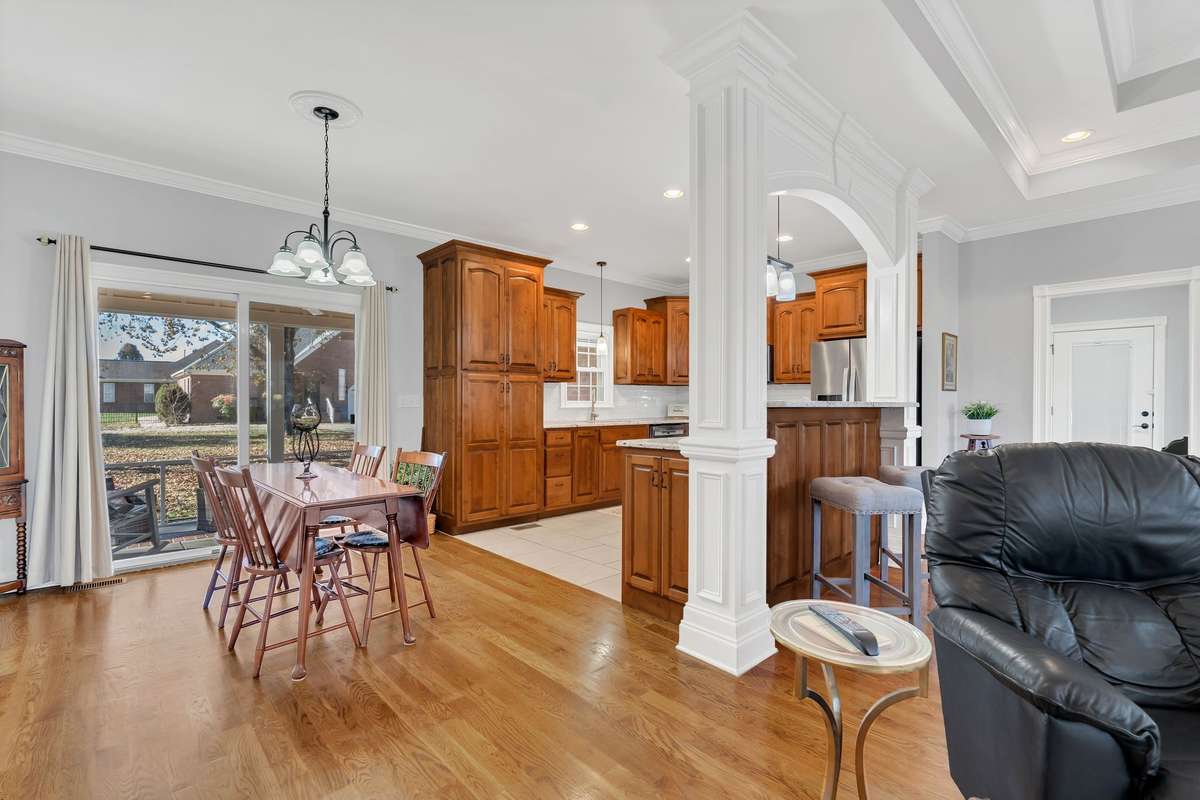 The Dining Room opens to the Kitchen, Great Room and Screened Patio.
