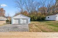 Grass area to the right of the garage