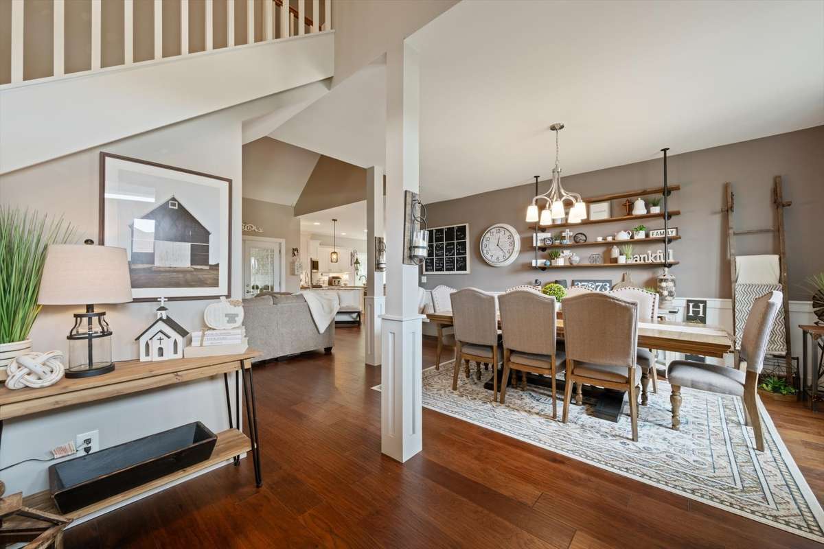 Open floor plan with hardwood floors and a large formal dining area.