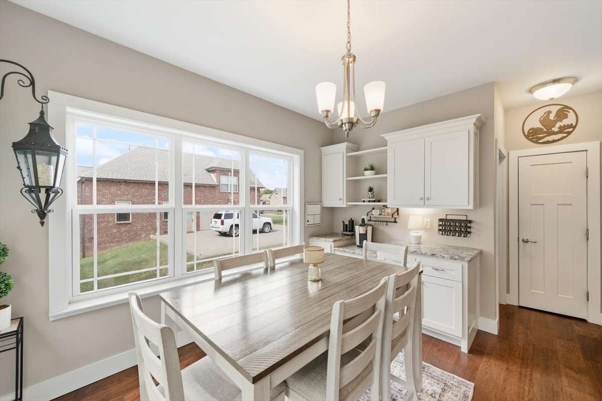 Breakfast nook has a great place for a coffee bar or butlers pantry
