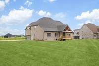 Builder will be adding Sod to the Front and Sides once weather permits, Back yard has already been seeded - This Photo was digitally edited to reflect.