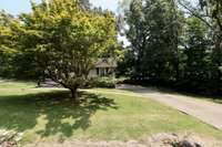 Tree-lined & private lot