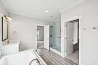 Your spa style bathroom includes dual vanities, a soaking tub, and a walk in tile shower. Thoughtfully designed for both function and luxury.