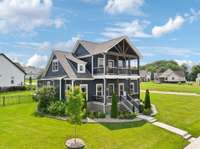 See the full picture: aerials showcase the home’s generous lot, corner placement, and its connection to the neighborhood.