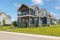 Welcome to 120 Pontoon Place! This corner lot craftsman stuns with curb appeal, double front porches, and lake views. Imagine sunsets from the upper porch and easy mornings on the lower.