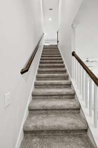 Stairway leading from main level upstairs.