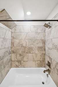 Modern finishes, tile accents, and sleek vanities give each bath style and convenience to match the home’s overall design.