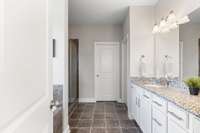 The primary bath with tile shower and separate soaking tub.