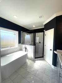 Owner's Bath with Freestanding Soaking Tub & Custom Tile Shower...