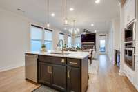 The island is beautiful and functional and has the perfect pendant lights to add light and beauty.