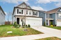 2 car garage and front porch large enough to have a seating area.