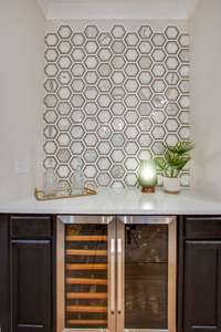 The sellers added a custom wine bar that is a wow!  It's even prettier in person.  Includes gorgeous tile wall, quartz counter tops and a wine fridge.