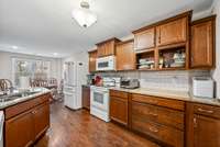 Home has custom cabinetry and drawers with built in chopping block.