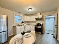 Open, inviting eat-in kitchen designed for both cooking and casual dining.