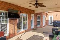 Ready to watch all the sports on this covered back porch!