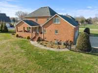 Covered back porch and fire pit area