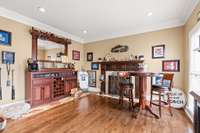 Formal living room area with gas log fireplace - could be used as an office