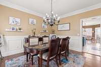 Dining room features wainscoting