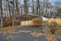 The detached carport can hold 1-2 vehicles.