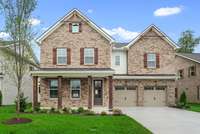 Brick Exterior with Carriage Garage Doors
*Photo of similar home in the community