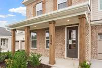 Covered front porch perfect for rocking chairs!