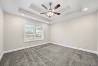 Primary bedroom features double-trey'd ceilings!