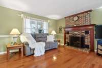 This stately, cozy fireplace is gas, but can be converted back to wood-burning easily.