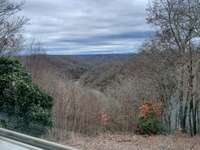 Primary bedroom lake & mountain views are breathtaking!
