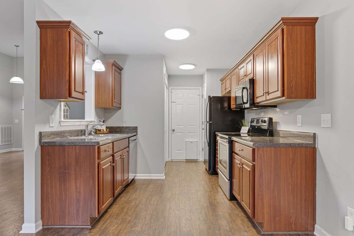 Kitchen: leading to garage, pantry and laundry closet. Garage has built in shelving.