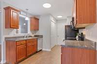 Kitchen: leading to garage, pantry and laundry closet. Garage has built in shelving.