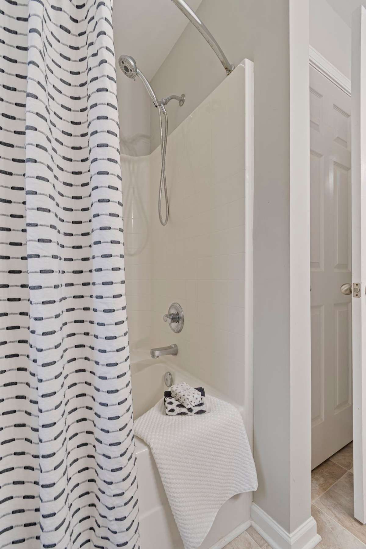 Primary Bedroom: Walk-in closet & full bath with soaker tub and double vanities