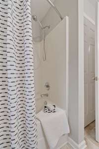 Primary Bedroom: Walk-in closet & full bath with soaker tub and double vanities