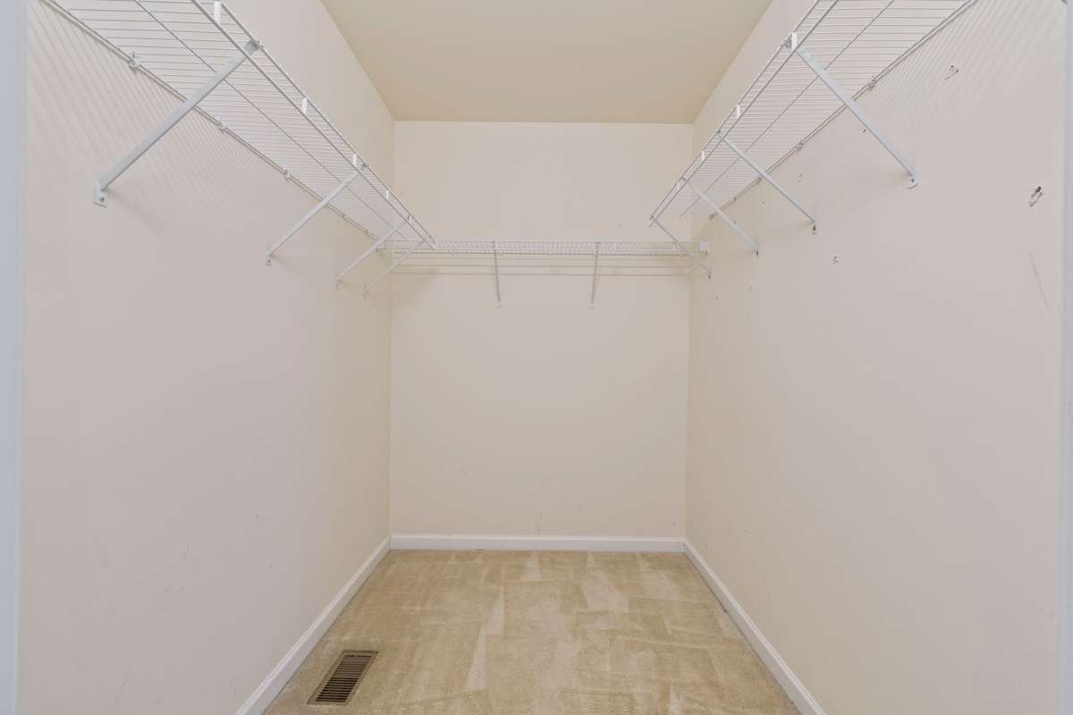 Primary Bedroom: Walk-in closet & full bath with soaker tub and double vanities